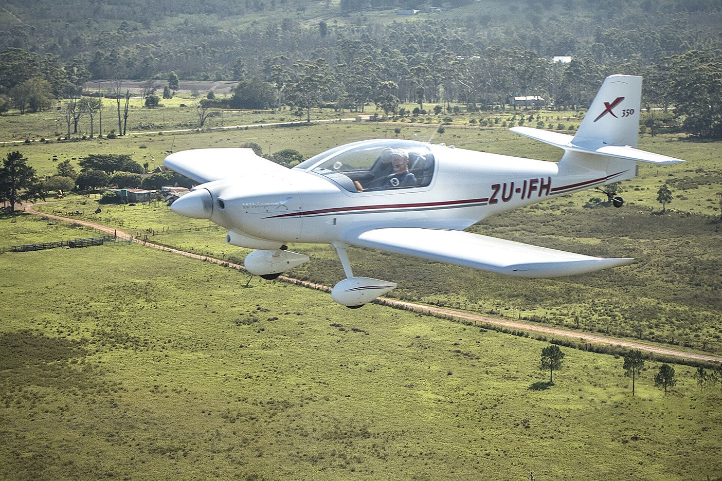 Whisper X350 flying over green countryside