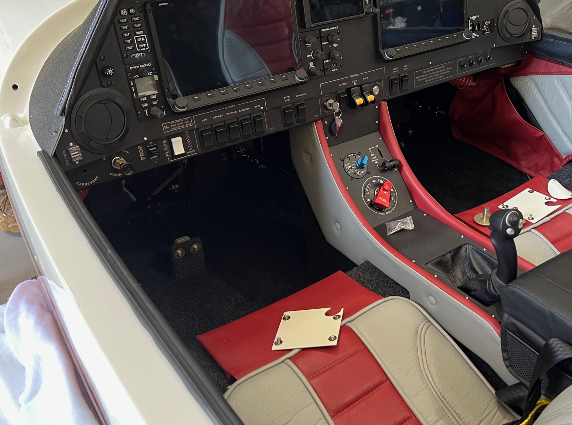 Whisper X350 cockpit with red interior and glass avionics